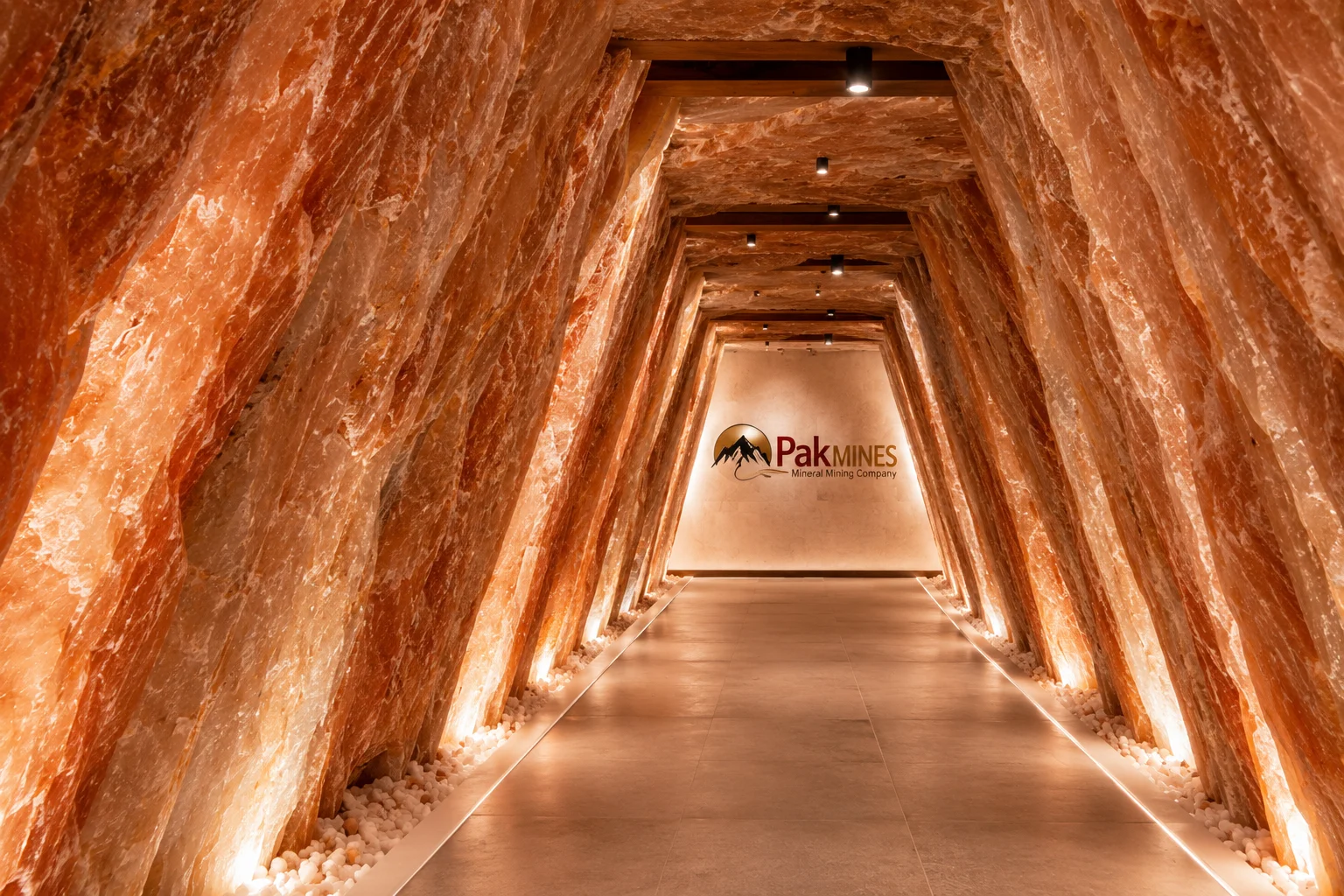 Illuminated Himalayan salt tunnel with the Pak Mines emblem